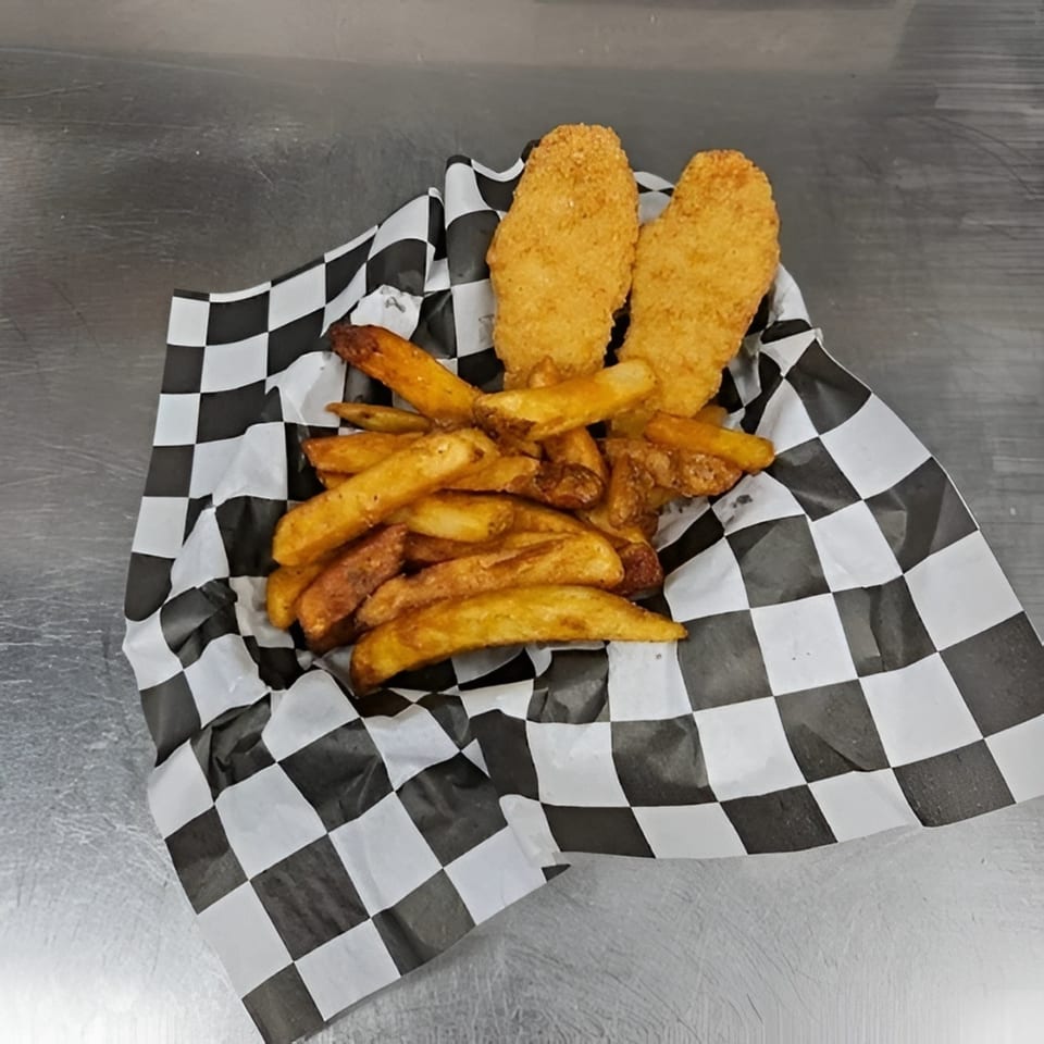 Golden-brown chicken tenders and thick-cut fries served in a checkered paper-lined basket.
